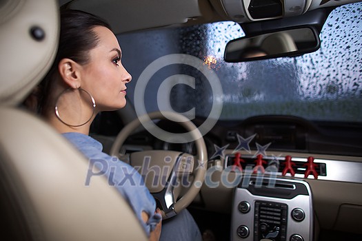 Pretty, young woman driving a car -Invitation to travel. Car rental or vacation. Pretty, young woman driving a car -Invitation to travel. Car rental or vacation.