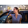 Pretty, young woman  driving a car -Invitation to travel. Car rental,  car ownership or vacation