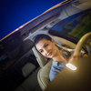 Pretty, young woman  driving a car -Invitation to travel. Car rental,  car ownership or vacation