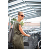 Pretty, young woman going grocery shopping with a trolley