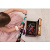 beautiful cute little girl in pink dress enjoying while playing with mother's jewelry from box on the floor at home
