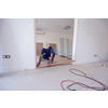 male workers carpenters installing interior glass door with a wooden frame at new luxury apartment