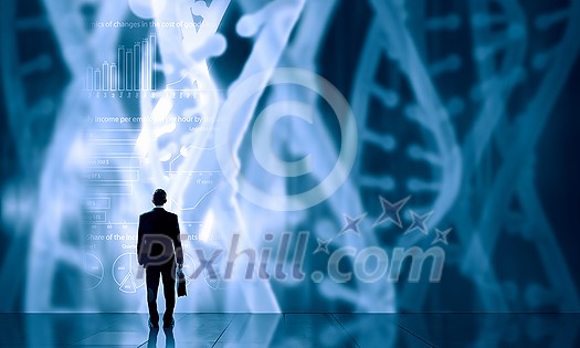 Businessman standing with back and virtual panel with dna spiral Businessman standing with back and virtual panel with dna spiral