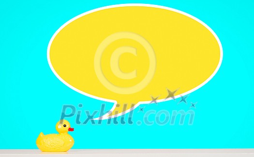 Yellow rubber duck toy on table with speech bubble Yellow rubber duck toy on table with speech bubble