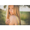 Portrait of young, pretty  woman outdoor on a summer sunny day