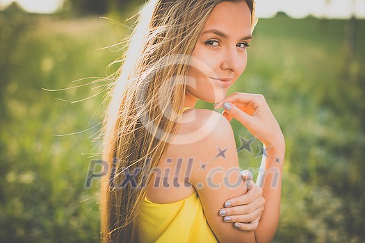 Portrait of young woman with radiant clean outdoor on a spring/summer sunny day Portrait of young woman with radiant clean outdoor on a spring/summer sunny day