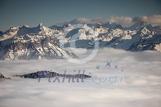 Splendid apline scenery. High mountains with fog and lovely evening light. Splendid apline scenery. High mountains with fog and lovely evening light.