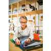 Pretty young woman  choosing the right material/color for her modern appartement interior (shallow DOF; color toned image)