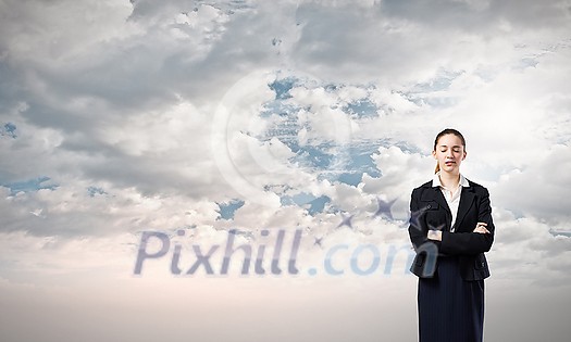 Young businesswoman with closed eyes thinking something over Young businesswoman with closed eyes thinking something over