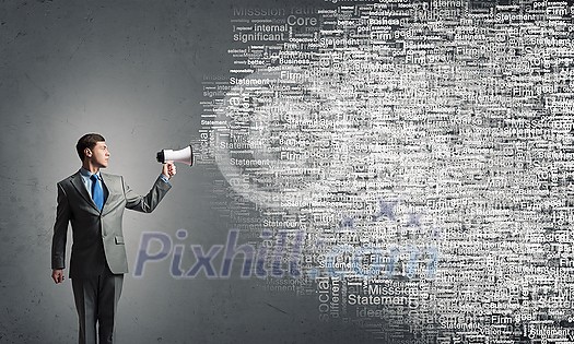 Young businessman with megaphone in hand announcing message Young businessman with megaphone in hand announcing message