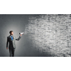 Young businessman with megaphone in hand announcing message