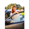 Pretty, young woman  driving a car -Invitation to travel. Car rental or vacation.