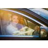 Pretty, young woman  driving a car -Invitation to travel. Car rental or vacation.