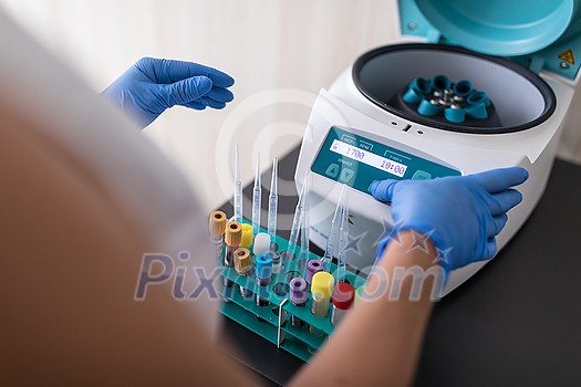 Nurse in a lab carrying out a blood test analysis amid deadly virus pandemic Nurse in a lab carrying out a blood test analysis amid deadly virus pandemic