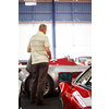 Old cars auction - People viewing cars on sale during an expensive old cars  auction