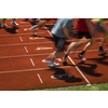 Runners starting a race on a running field (motion blurred image)
