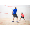 Squash players in action on a squash court (motion blurred image; color toned image)