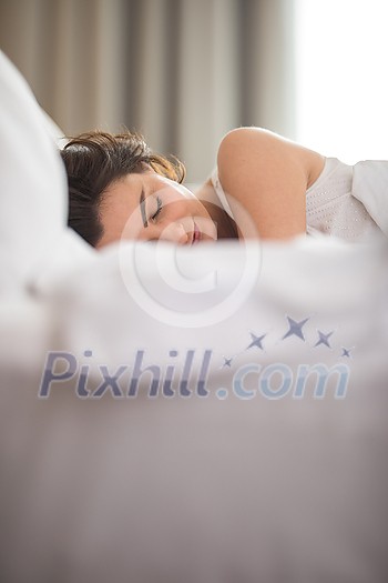 Beautiful young woman sleeping on bed at bedroom Beautiful young woman sleeping on bed at bedroom