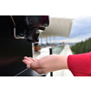 Guests in restaurant Washing hands using automatic gel disinfection sanitizer.  Coronavirus prevention in a caffee restaurant   during the corona virus epidemic and new normal outbreak concept