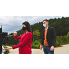 Guests in restaurant Washing hands using automatic gel disinfection sanitizer.  Coronavirus prevention in a caffee restaurant   during the corona virus epidemic and new normal outbreak concept