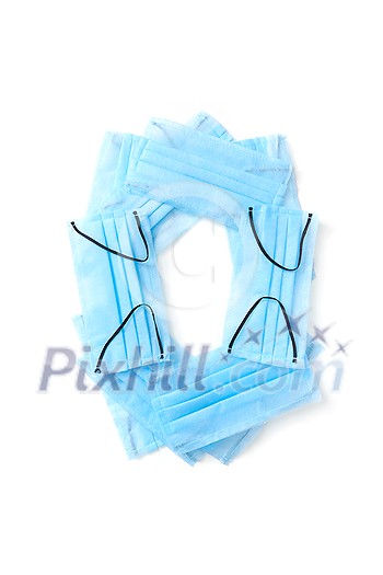 Capital letter O handmade from medical antibacterial protective blue face masks on a white background, copy space. Creative alphabet for making up new words. Capital letter O handmade from medical antibacterial protective blue face masks on a white background, copy space. Creative alphabet for making up new words.