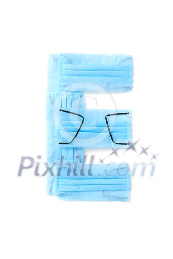 Capital letter E handmade from medical antibacterial protective blue face masks on a white background, copy space. Creative alphabet for making up new words. Capital letter E handmade from medical antibacterial protective blue face masks on a white background, copy space. Creative alphabet for making up new words.