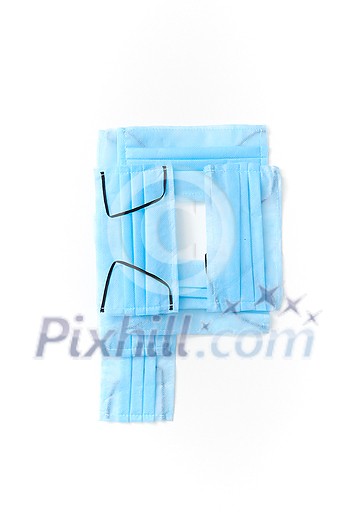 Capital letter P handmade from medical antibacterial protective blue face masks on a white background, copy space. Creative alphabet for making up new words. Capital letter P handmade from medical antibacterial protective blue face masks on a white background, copy space. Creative alphabet for making up new words.