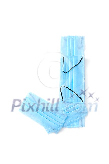 Capital letter J handmade from medical antibacterial protective blue face masks on a white background, copy space. Creative alphabet for making up new words. Capital letter J handmade from medical antibacterial protective blue face masks on a white background, copy space. Creative alphabet for making up new words.