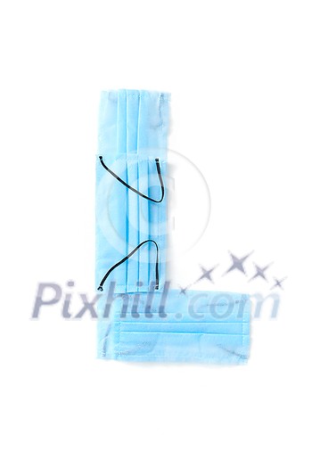 Capital letter L handmade from medical antibacterial protective blue face masks on a white background, copy space. Creative alphabet for making up new words. Capital letter L handmade from medical antibacterial protective blue face masks on a white background, copy space. Creative alphabet for making up new words.