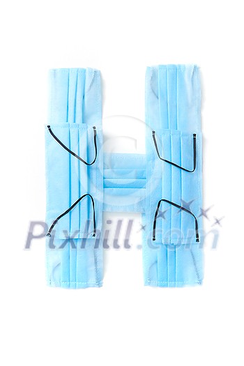 Capital letter H handmade from medical antibacterial protective blue face masks on a white background, copy space. Creative alphabet for making up new words. Capital letter H handmade from medical antibacterial protective blue face masks on a white background, copy space. Creative alphabet for making up new words.