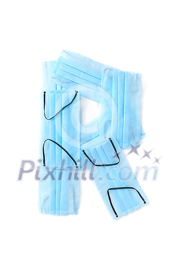Capital letter R handmade from medical antibacterial protective blue face masks on a white background, copy space. Creative alphabet for making up new words. Capital letter R handmade from medical antibacterial protective blue face masks on a white background, copy space. Creative alphabet for making up new words.