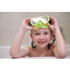 little girl with snorkel goggles in the tub while taking a bath in the bathtub, kids hygiene concept and summer vacation in corona virus stay at home