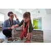 Mother and little girl daughter playing with jewelry while staying at home in coronavirus quarantine