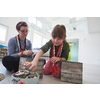Mother and little girl daughter playing with jewelry while staying at home in coronavirus quarantine