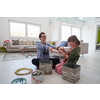 Mother and little girl daughter playing with jewelry while staying at home in coronavirus quarantine
