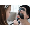 Family at home beauty treatment during coronavirus pandemic stay at home quarantine. Mother and little girl daughter  make a facial mask.
