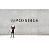 Young businesswoman with huge pencil changing word impossible
