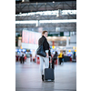 Pretty young female passenger at the airport (shallow DOF; color toned image)