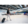 Pretty young female passenger at the airport (shallow DOF; color toned image)