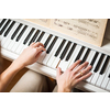 Playing Piano (shallow DOF; color toned image)