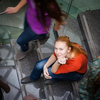 At the university/college - Students rushing up and down a busy stairway - confident pretty young female student looking upwards