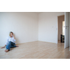 Just moved in: pretty,  young woman having a drink in her brand new modern apartment