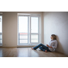 Just moved in: pretty,  young woman having a drink in her brand new modern apartment
