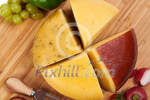 Organic Cheese healthy gourment food produced on local farm assortment on wooden background Organic Cheese healthy gourment food produced on local farm assortment on wooden background