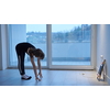 Little girl have online training while watching the tablet and doing fitness and modern ballet dance exercise at home. Online education concept class in modern ballet school. Social distance during quarantine, self-isolation in coronavirus pandemic staying at home time.
