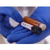 Coronavirus, Doctor holding positive covid-19 virus Blood Sample tube and medicine cure drug