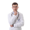 Portrait of hero in white coat.  Cheerful smiling young doctor with stethoscope in medical hospital standing against white  background. Coronavirus covid-19 danger alert