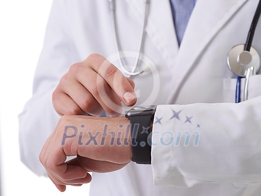 Partial view of male doctor using smartwatch while checking heartbeat pulse Partial view of male doctor using smartwatch while checking heartbeat pulse