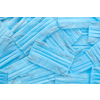Medical creative backdrop from antibacterial protective blue face masks chaotically arranged. Concept of prevention from respiratory sickness and viruses.