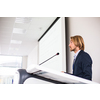 Handsome young man giving a speech at a conference